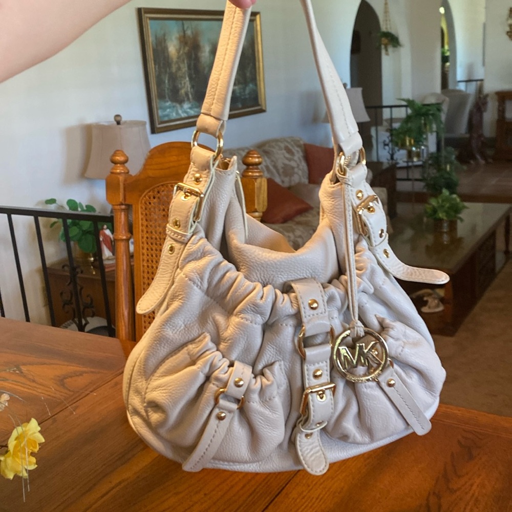 MICHAEL Kors cream colored shoulder bag, gold accents and emblem, gently used